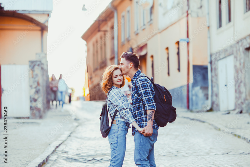 Romantic couple embracing on the street of old city Romantic couple embracing on the street of old city
