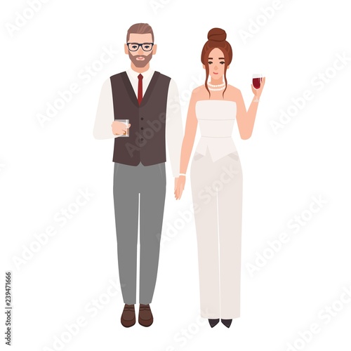 Elegant romantic couple in luxury evening outfits holding glasses with drinks...