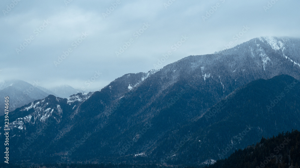 mountains with snow during blue hour