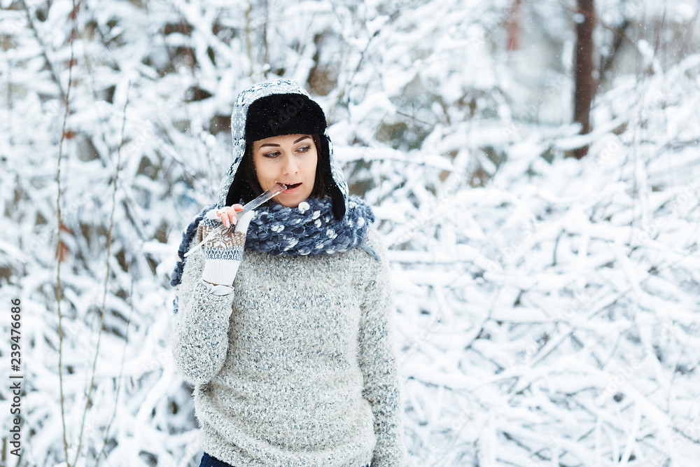 Beautiful girl with icicle in her hands Beautiful girl with icicle in her hands