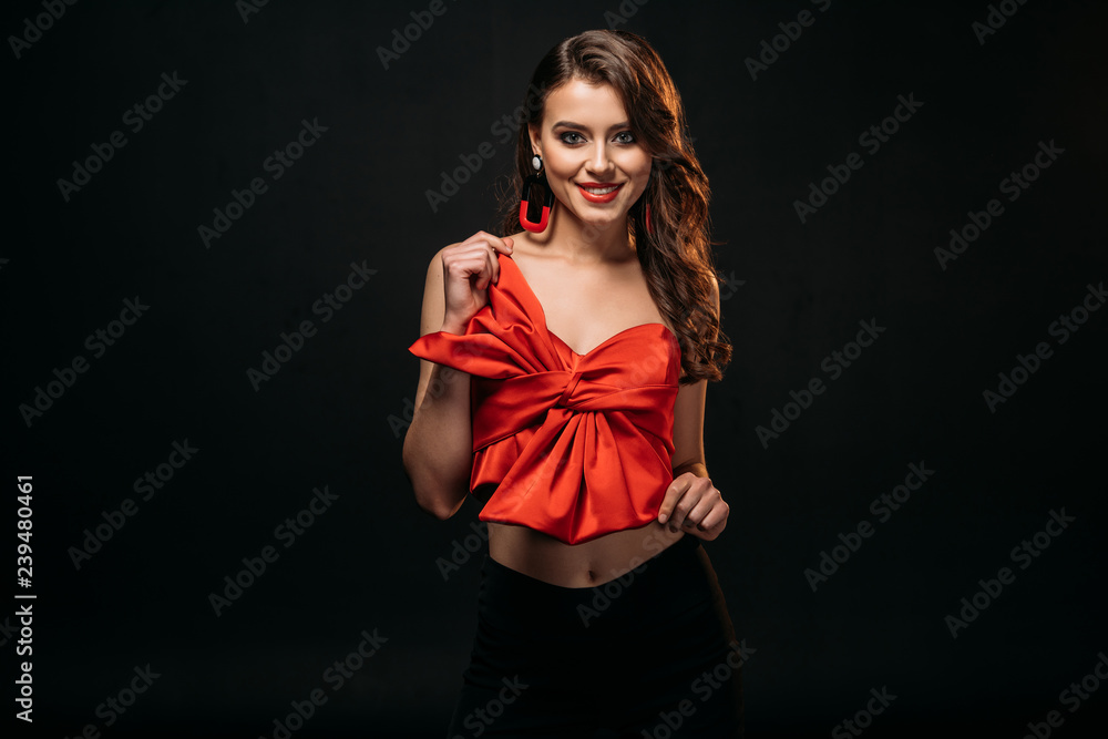 beautiful brown haired girl in red corset looking at camera isolated on black beautiful brown haired girl in red corset looking at camera isolated on black