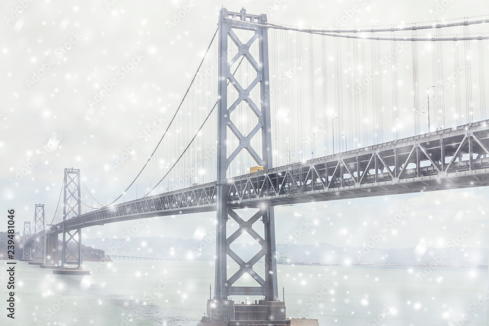The view on the Bay Bridge and Treasure Island from San Francisco in the snowfall.