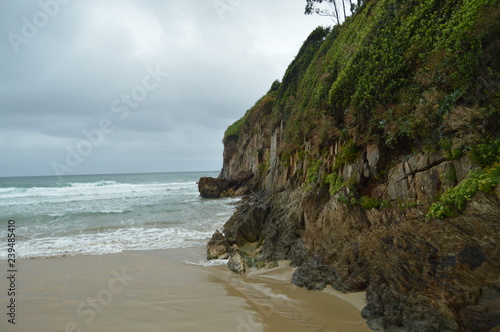 Nice Green Cliff On The Beach Of El Aguilar On A Rainy Day. July 29, 2015. Landscapes, Nature, Travel. Muros De Nalon, Asturias, Spain.