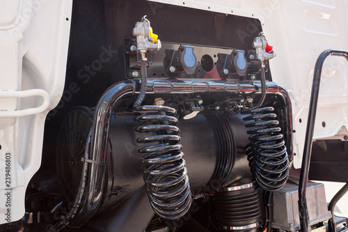 Engine and compressed air hoses of a truck