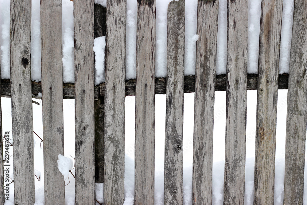 Picket fence snow covered old aged brown winter Picket fence snow covered old aged brown winter