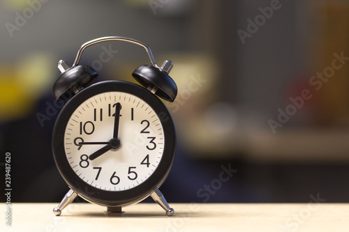  Black Alarm Clock on desk table