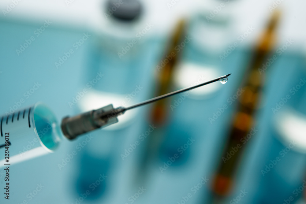 Close up Syringe needle medicine with liquid medicine drop Close up Syringe needle medicine with liquid medicine drop