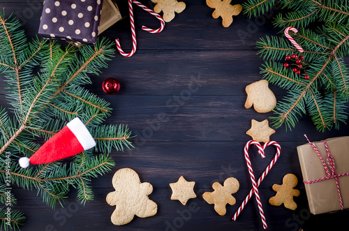 Christmas composition with gingerbread on wooden table photo