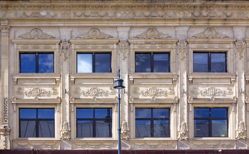 Vintage architecture classical facade building richly decorated with architectural details, Front view.
