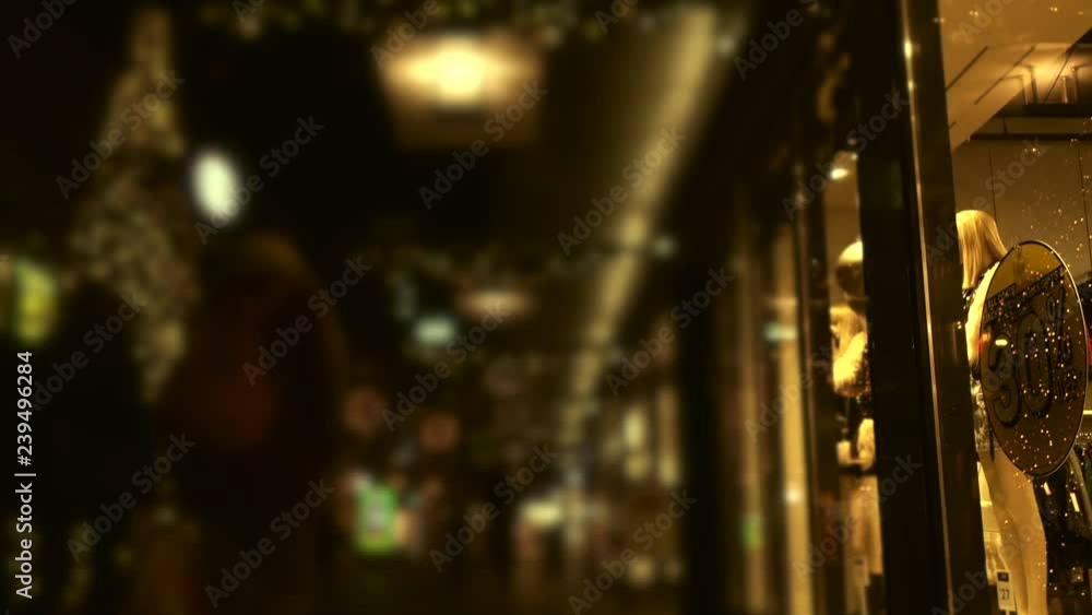 Shopping at Christmas . Black Friday. Christmas festive blurred video background. Busy shopping street with Christmas decorations Shopping at Christmas . Black Friday. Christmas festive blurred video background. Busy shopping street with Christmas decorations