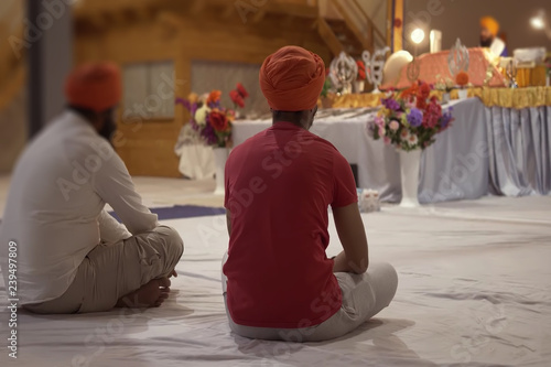 Abstract, blur, bokeh background, defocusing - image for the background. Two men in the temple