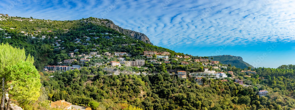 Townscape of Eze village, panoramic view over the historic house architecture on the hiil in botanical garden of France