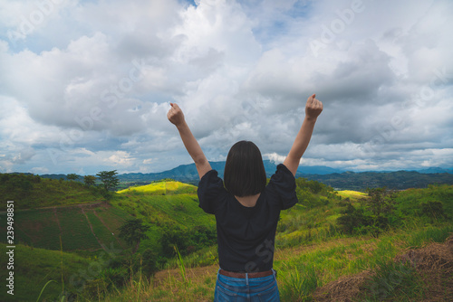 Happy young cute asian Japanese girl hipster backpack women travelling looking at beautiful sky mountains scenery view