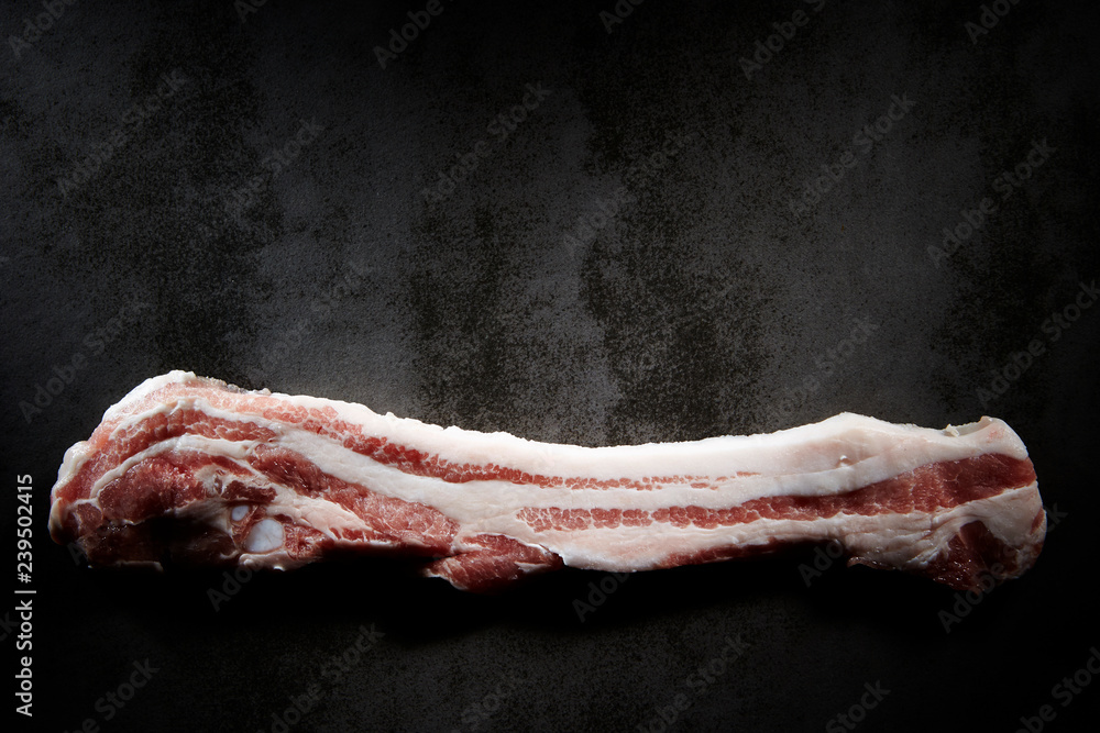 Pork belly on black background Stock Photo | Adobe Stock
