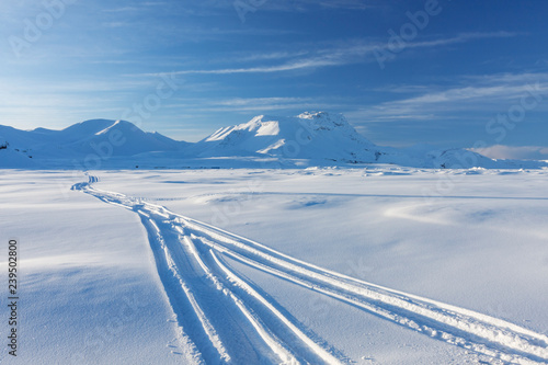 Snowmobile tracks in beautiful Blue Mountains Iceland.