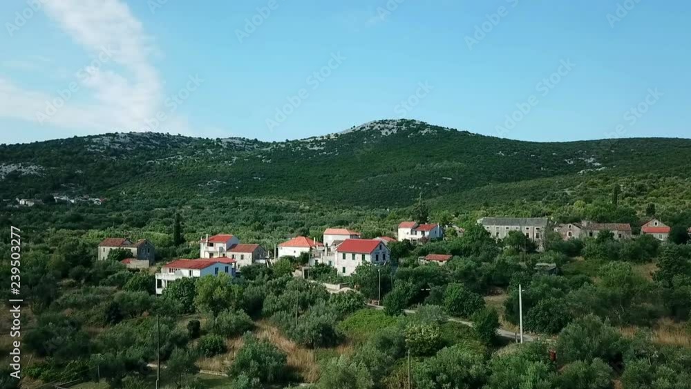 Aerial: Flying over beautiful green village Mrljane at Pasman island. Shot on vacation in Croatian sea at Mediterranean coastline. Aerial: Flying over beautiful green village Mrljane at Pasman island. Shot on vacation in Croatian sea at Mediterranean coastline.