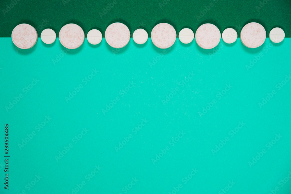 Pharmaceutical medicine pills, capsules on colored background. Pharmaceutical medicine pills, capsules on colored background.