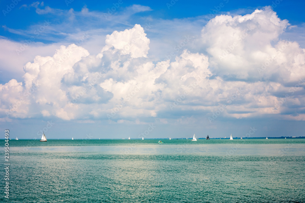 Fototapeta premium Lake Balaton with a nice cloudscape and sailboats in Hungary