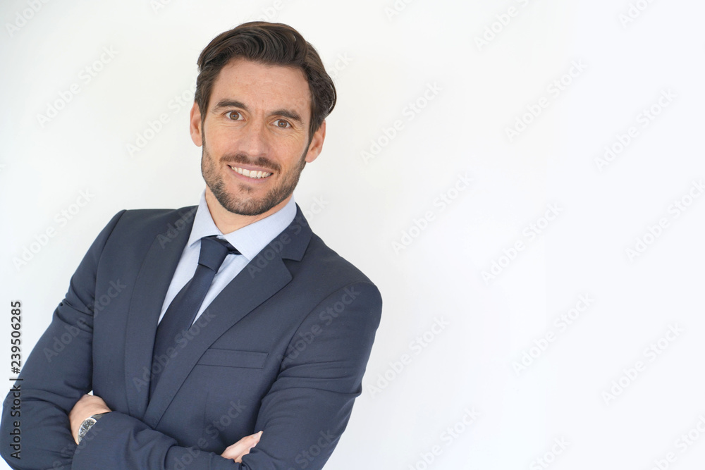Isolated handsome businessman smiling in tailored suit Isolated handsome businessman smiling in tailored suit
