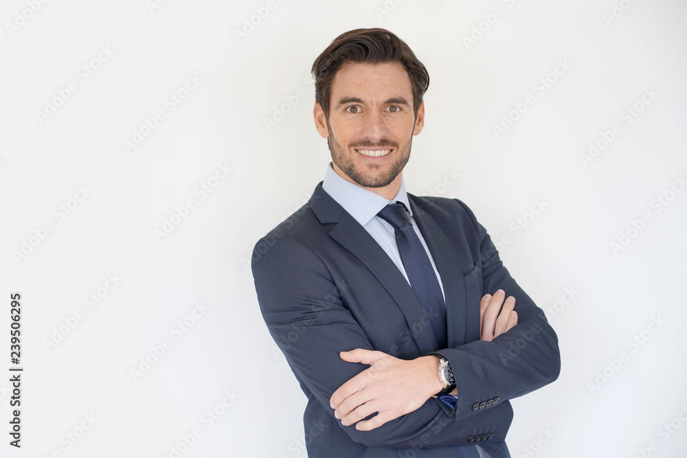Isolated handsome businessman smiling in tailored suit Isolated handsome businessman smiling in tailored suit