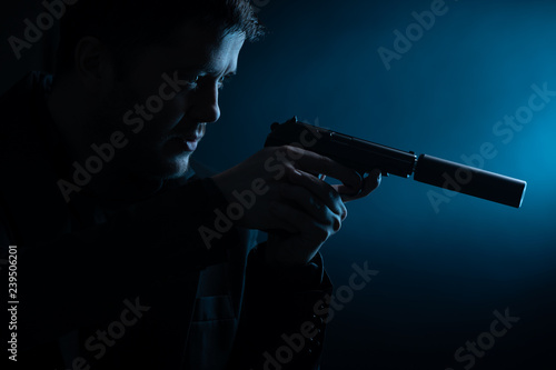 Image of side of thug with pistol photo