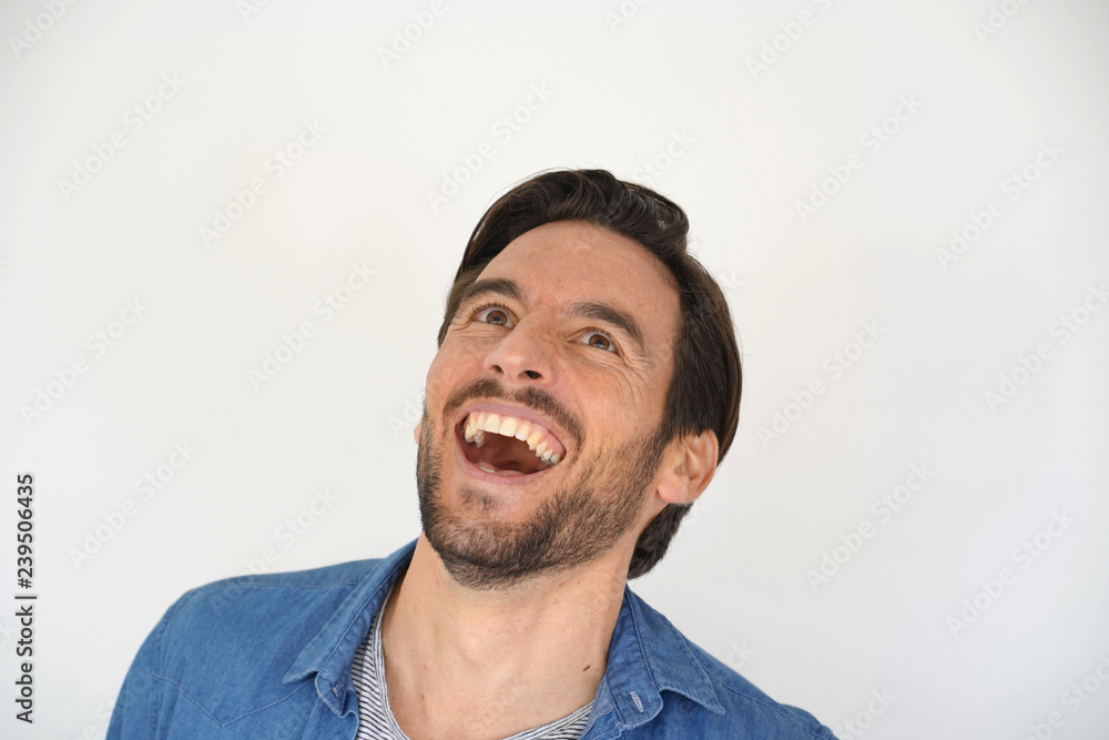 Portrait of carefree laughing handsome man on white background Portrait of carefree laughing handsome man on white background