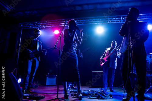 Photography Musicians perform on stage in the club.