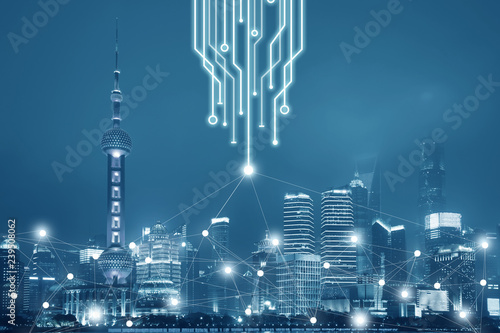 Fototapeta Technology connection in the big city network business concept. The background is Shanghai City skyline unban view at night.