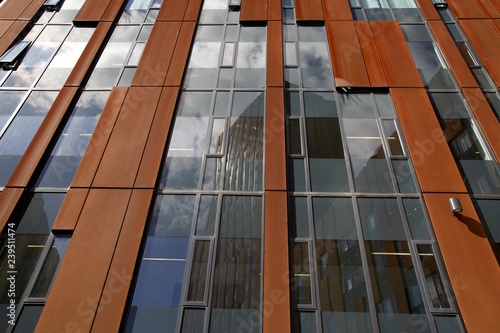 rusty finish of modern architecture in a City centre with a blue sky photo