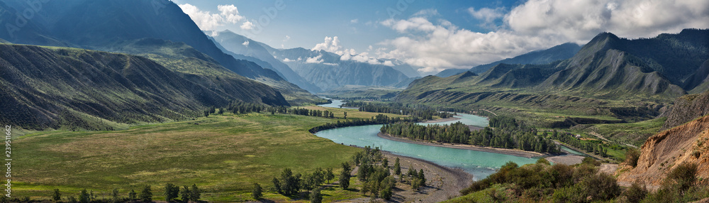 panorama of the summer landscape in the mountains. The valley of the mountain river Katun turquoise. the river flows between mountains and wide fields. blue sky and clouds view from high point
