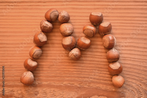 the letter M shaped with hazelnuts