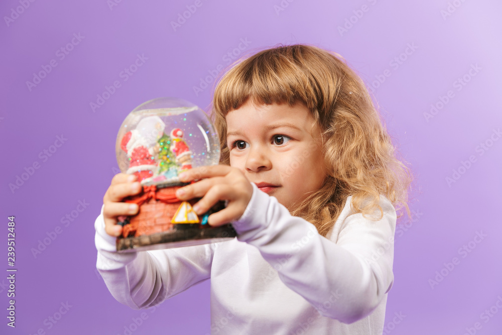 Pretty little girl holding christmas ball isolated Pretty little girl holding christmas ball isolated