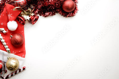 The background is decorated with a Santa Claus hat and Christmas toys with a copy space. Concept new year backgrounds for texts.