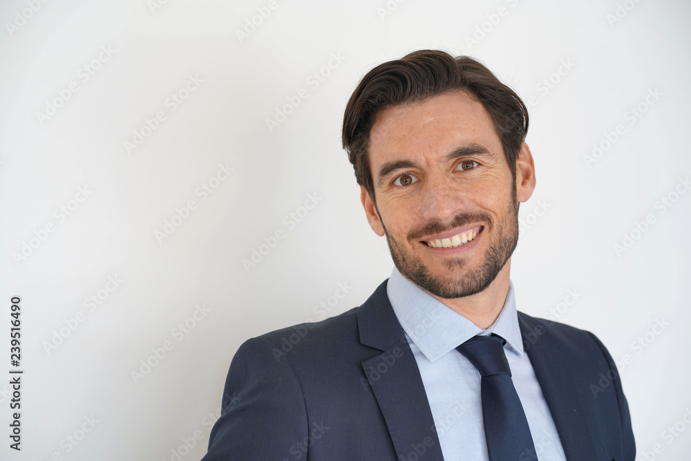 Isolated portarit of handsome businessman smiling in business suit Isolated portarit of handsome businessman smiling in business suit