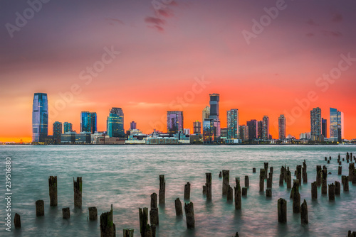 Jersey City, New Jersey, USA skyline on the Hudson River just after sunset. photo