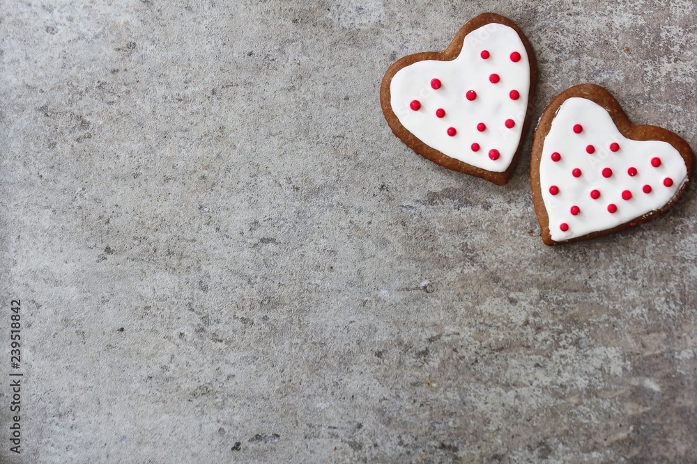 Obraz premium Valentines day background with heart shaped frosted cookies