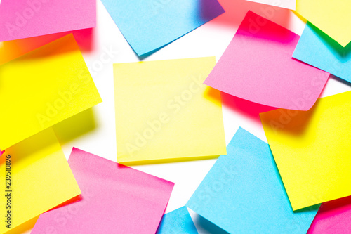 Many colorful sticky notes on white background