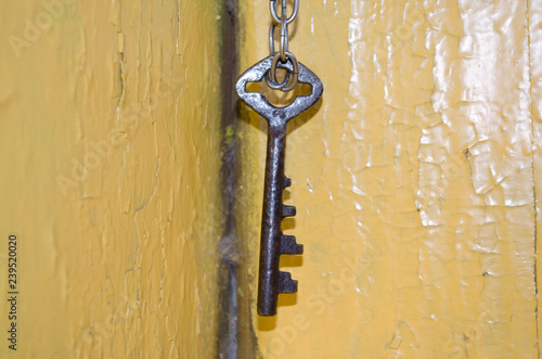 Old key hanging on a chain © Никита Богачев