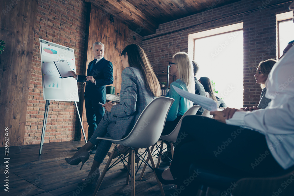 Close up photo of telling business secrets of income earnings, savings, management, development boss and workers making notes with agreement all dressed in formal wear jackets and shirts