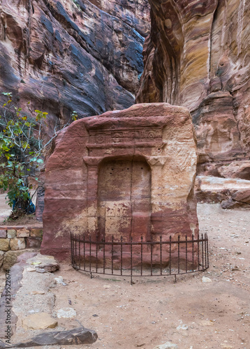 Tomb of the god of Nabatean - Dushara at the canyon leading to Petra - the capital of the Nabatean kingdom in Wadi Musa city in Jordan photo