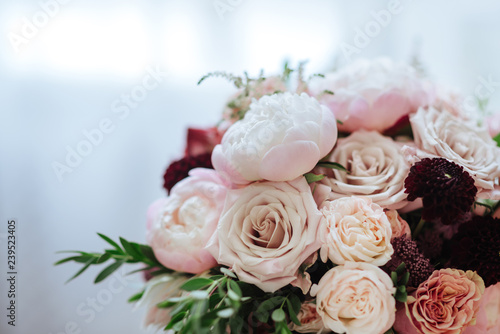 wedding bouquet with rose bush, Ranunculus asiaticus as a background © Margo Basarab