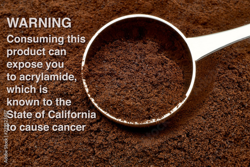 Acrylamide warning sign on ground or grinded coffee photo