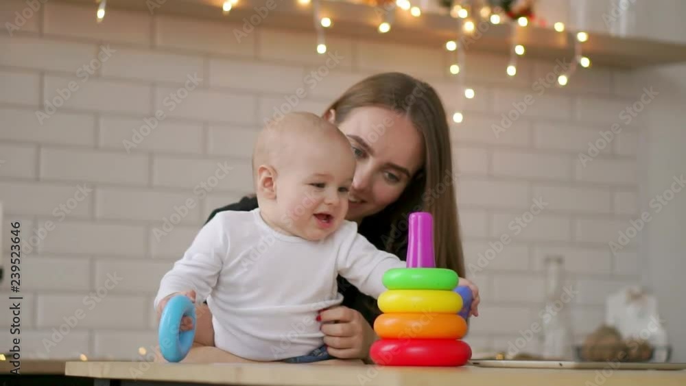 little child boy and his mommy play with toys at home little child boy and his mommy play with toys at home