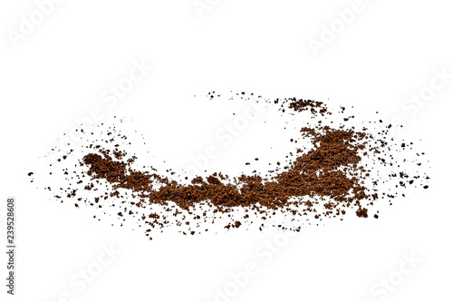 Spilled grinded coffee powder with coffee cup space isolated on white background