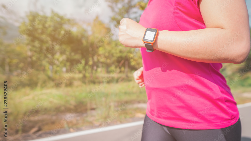Women exercise in the morning with SmartWatch.