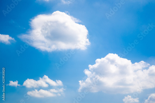 Beautiful big white clouds in the blue sky in sunny day. © DG PhotoStock