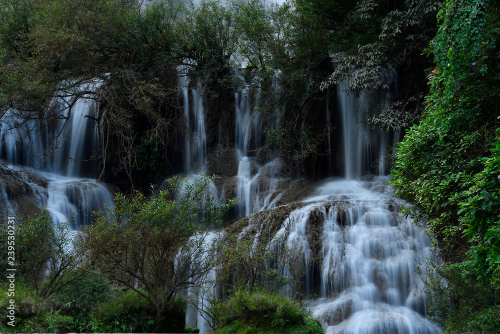 Great waterfall in Thailand. Beautiful waterfall in the green forest. Waterfall in tropical forest at Umpang National park, Tak, Thailand.