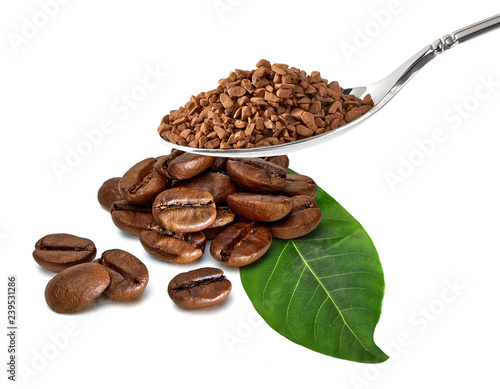 Instant granulated coffee in spoon with coffee beans isolated on white background