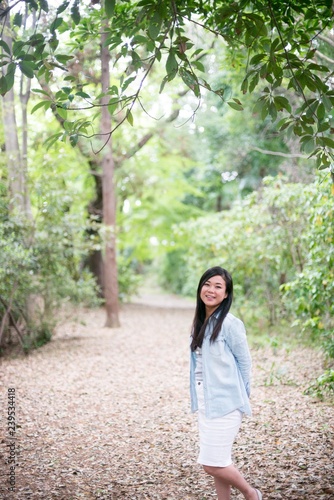 Asian female model poses for pictures on the street