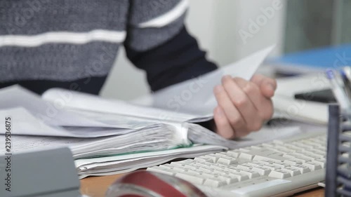 a man working in the office in the workplace. too much work